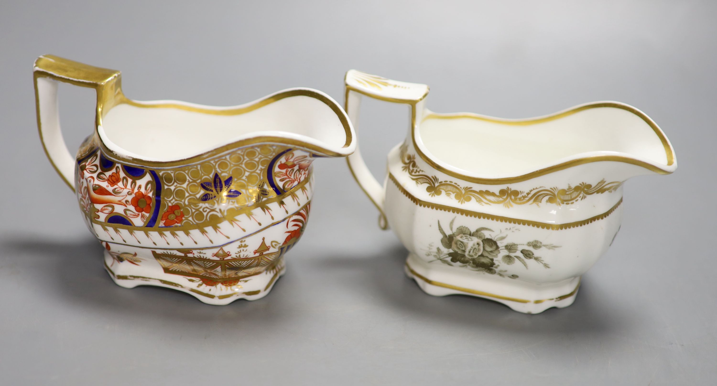 A Spode cream jug painted with Imari pattern 1495, and a Spode cream jug painted with sepia flowers under a gold border, pattern 3527,